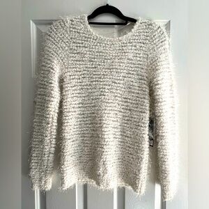 NWT-Jennifer Lopez gilded glamour crew neck long sleeve in size XS.